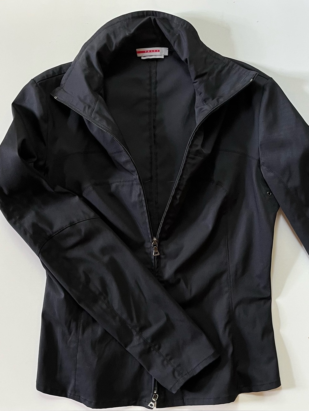 Black Prada Sport fitted nylon jacket with peplum. Pristine condition. Size 44
